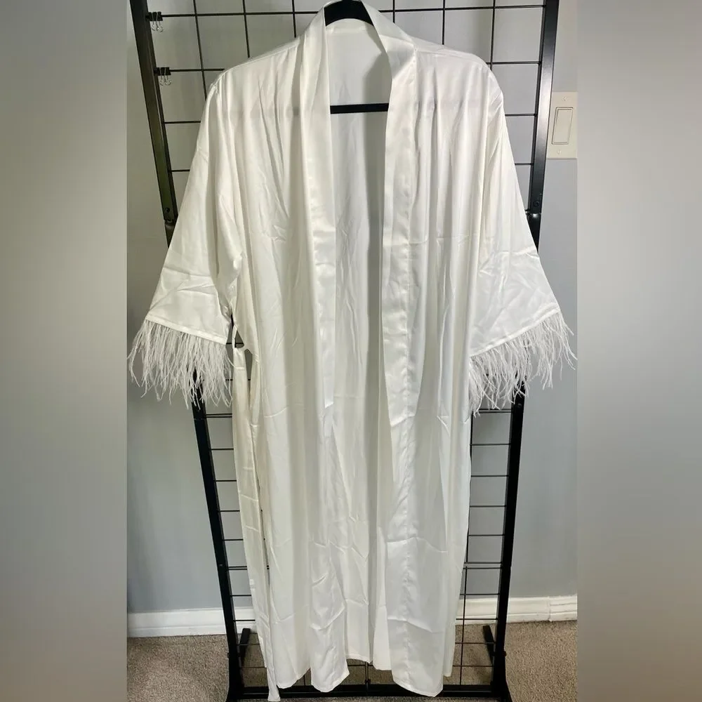 White robe with feather accent on sleeves NWOT